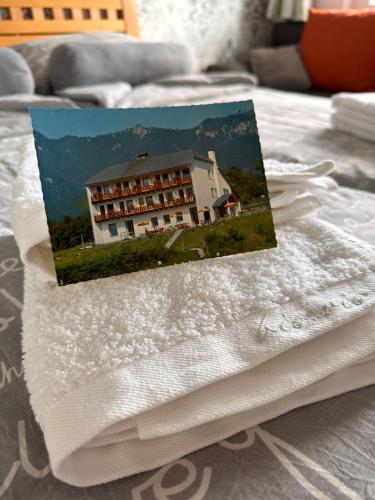 a picture of a hotel on top of a bed at Berghaus Gesäuse in Weng im Gesäuse