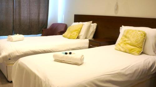 Krevet ili kreveti u jedinici u okviru objekta OYO Oban Hotel