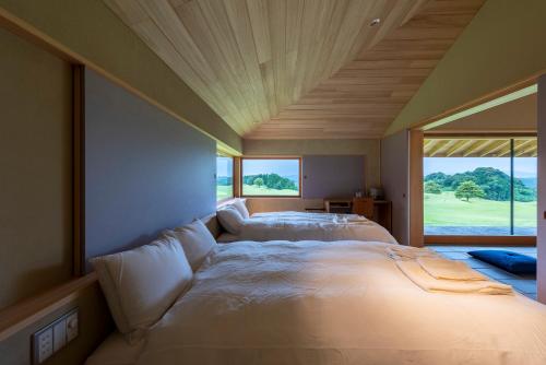 A bed or beds in a room at KATADA Lodge & Villa
