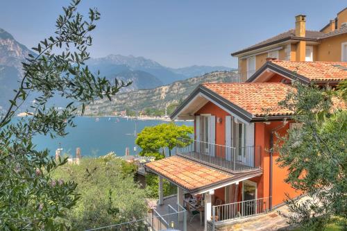 a house with a view of a body of water at Villa Il Paradiso Di Gabri - Happy Rentals in Nago-Torbole