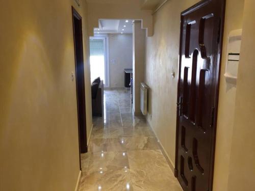 a hallway leading to a room with a hallway at 2 minutes from Sheraton Oran. Come and relax here. in Oran