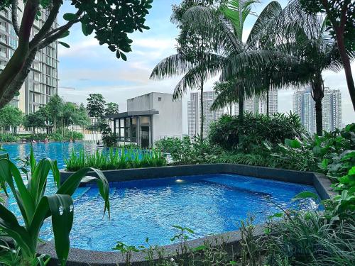 a swimming pool in the middle of a city at Elysia Park Residence Medini by Stayrene in Nusajaya