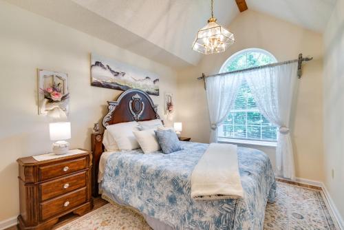 a bedroom with a bed and a window at Hot Tub, Game Room and Fire Pit Pocono Summit Home! in Pocono Summit