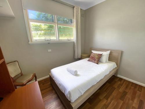 Postel nebo postele na pokoji v ubytování Leafy Lodge Secluded retreat in East Tamworth