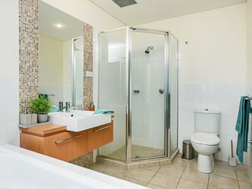 a bathroom with a shower and a sink and a toilet at Relax in Style Comfort in Victor Harbor