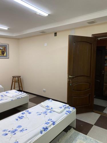 Ένα ή περισσότερα κρεβάτια σε δωμάτιο στο Mang’o Hostel