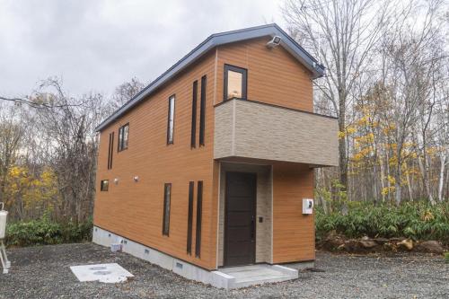 a house that is sitting on a lot at Audrey Chalet in Niseko
