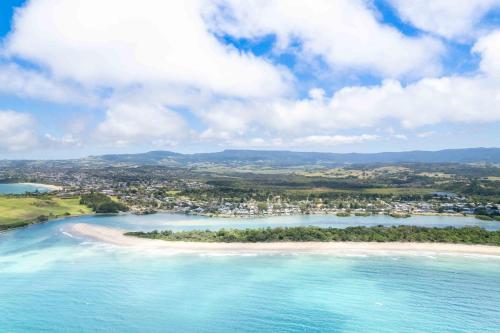 an aerial view of a small island in the ocean at Absolute waterfront beach house in Minnamurra