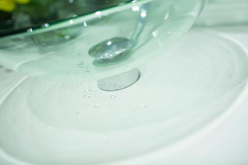 a drop of water on a table with a spoon at iclub Mong Kok Hotel in Hong Kong