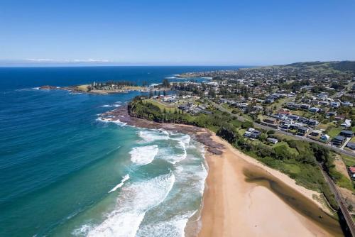 an aerial view of the beach and ocean at Pod on the Park in Kiama