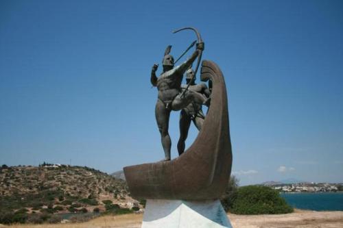 a statue of a man standing on a spear at KOLLITAKI in Selínia