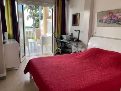 En eller flere senge i et værelse på Appartement BlueLAGON