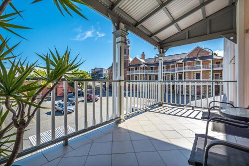 a balcony with a view of a parking lot at Foreshore Apartment 104 in Albany
