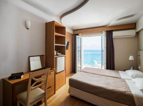 Postel nebo postele na pokoji v ubytování El Greco Hotel