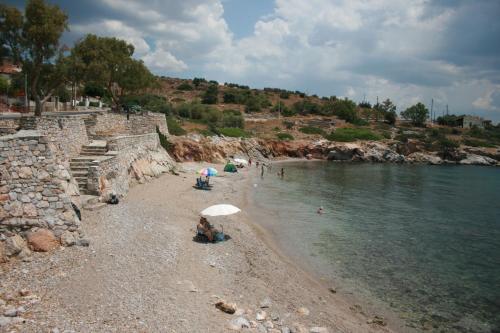 a group of people on a beach near the water at KOLLITAKI in Selínia