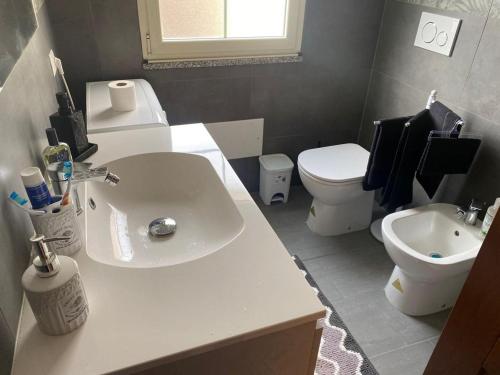 a bathroom with a sink and a toilet at mario's home in Pula