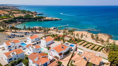 an aerial view of a resort and the beach at Beach Front Aqua Marina by Ezoria Villas in Paralimni
