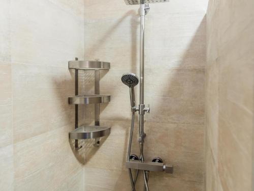 a shower with two faucets in a bathroom at REf 38 CASA GUSTAVO in Zahara de los Atunes