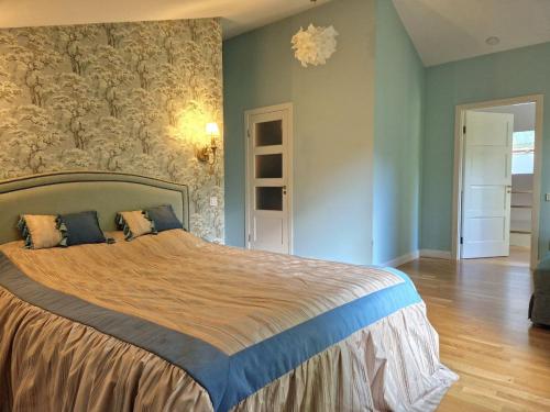 a bedroom with a large bed in a room at Zalves House in Riga