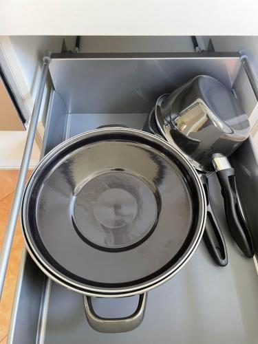 a metal sink with a strainer and a strainer at my Relaxs little Villa in Bludenz