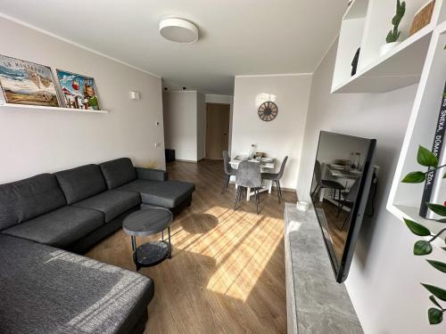 a living room with a couch and a table at Apartment in Birstonas in Birštonas