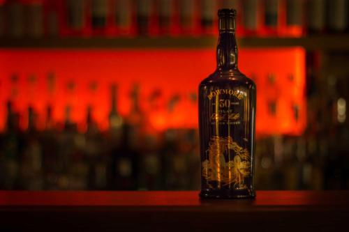 a bottle of alcohol sitting on a table at Hotel Englhof in Zell am Ziller