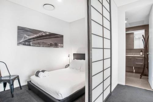 Voodi või voodid majutusasutuse The Zen Apartments with Urban Soul toas