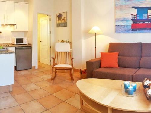 a living room with a couch and a table at REf 51 APARTAMENTO MARINA in Zahara de los Atunes