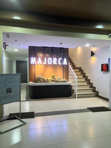 a large sign for a mazora store in a building at 3P Majorca , Camella Manor Mandalagan in Bacolod