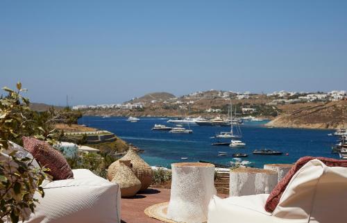 a view of a harbor with boats in the water at Once in Mykonos - Designed for Adults in Ornos