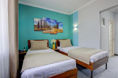 Postel nebo postele na pokoji v ubytování Viva Hotel