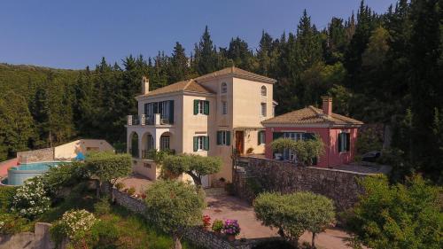 an aerial view of a house with a swimming pool at Boutique Villa Andronice in Tsoukaladhes