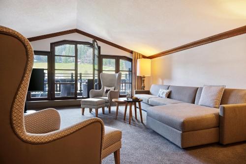 a living room with a couch and chairs at Parkhotel Oberstaufen in Oberstaufen