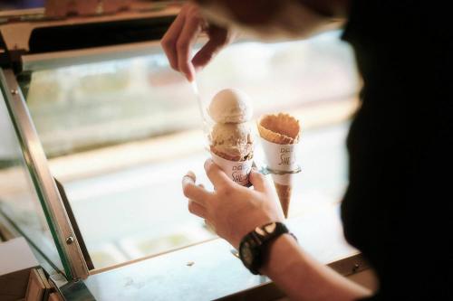 a person is holding an ice cream cone at Hotel She, Kyoto in Kyoto