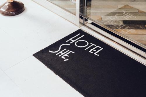 a black door mat with the word foot on it at Hotel She, Kyoto in Kyoto