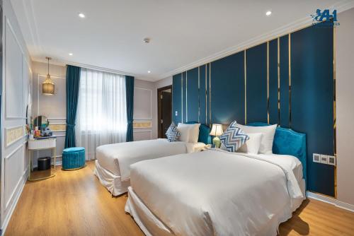 Angel Hotels Beach Danangにあるベッド