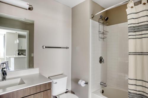 a bathroom with a toilet and a sink and a shower at N Station 1BR w WD Gym nr TD Garden BOS-705 in Boston