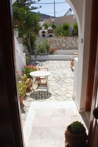 a view of a patio with a table and some plants at Aristidis in Galissas
