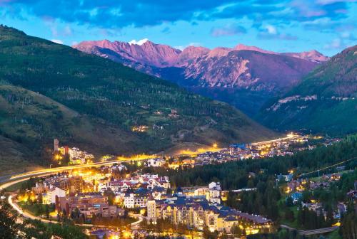 a city in the mountains at night at Lift House Lodge, Downtown Lionshead Remodeled Studio Condo in Vail