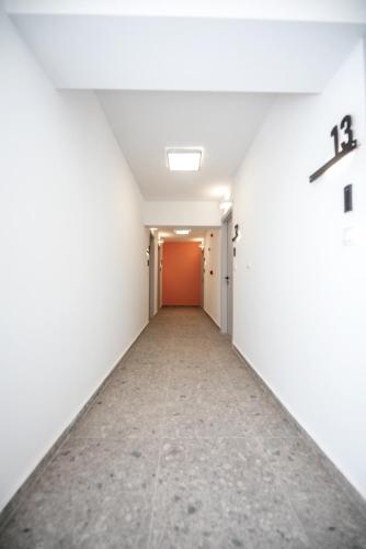 an empty corridor in an empty room with at LASARI comfort living in Thessaloniki