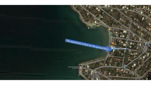 a blue sign that reads its permitted place at the beach at Beachfront 2-bedroom apartment in Salamís
