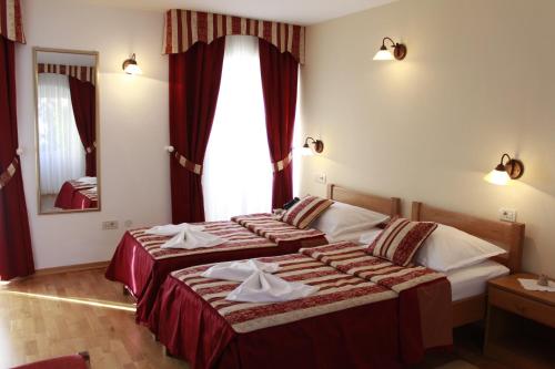 מיטה או מיטות בחדר ב-Villa Kula