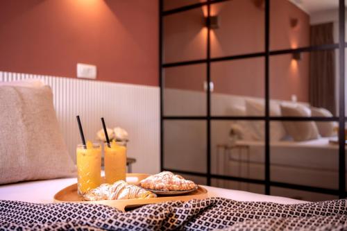Katil atau katil-katil dalam bilik di Fingerprint Central Apartment 5 min from Center & Beach