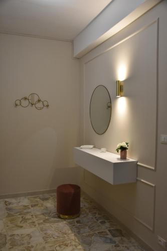 a bathroom with a sink and a mirror at Russo Apartment in Termoli