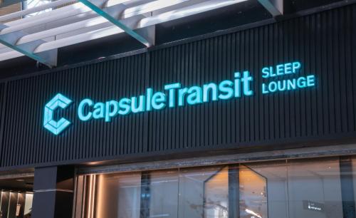 un cartello sul lato di un edificio di Capsule Transit Sleep Lounge KLIA T1 - Landside a Sepang