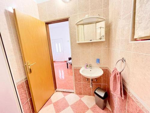 a bathroom with a sink and a mirror at Spacious apartment in Poreč 1 bedroom in Poreč