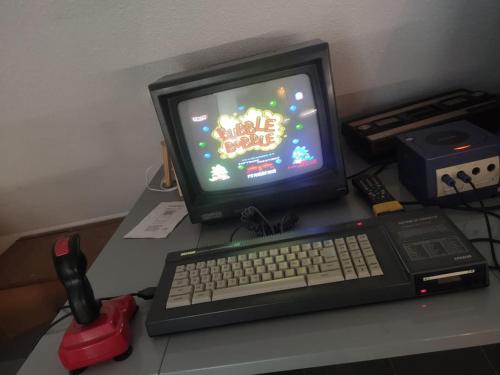 a computer monitor and keyboard on a desk at Studio ludique campagnard (classé 3*) in Petersbach