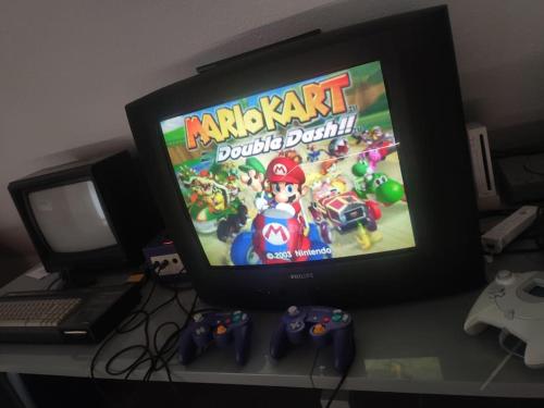 a television with a video game on the screen at Studio ludique campagnard (classé 3*) in Petersbach
