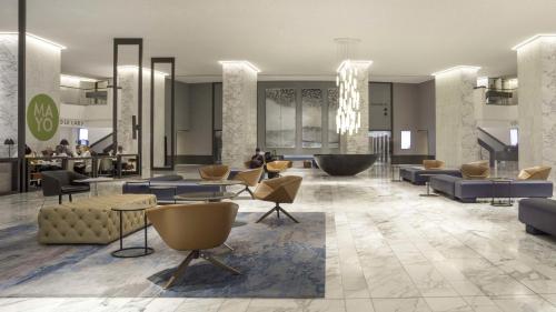 a rendering of a lobby with couches and chairs at Hyatt Regency Paris Etoile in Paris