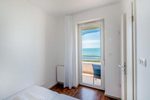 Ένα ή περισσότερα κρεβάτια σε δωμάτιο στο MyFlat Club 218 Belvedere Wellness Apartment